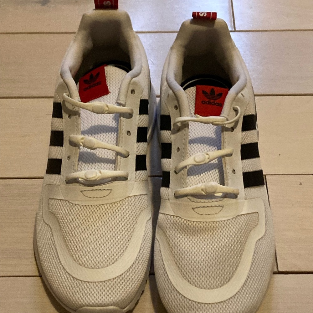 Adidas White Sneakers with Black Stripes and Red Details